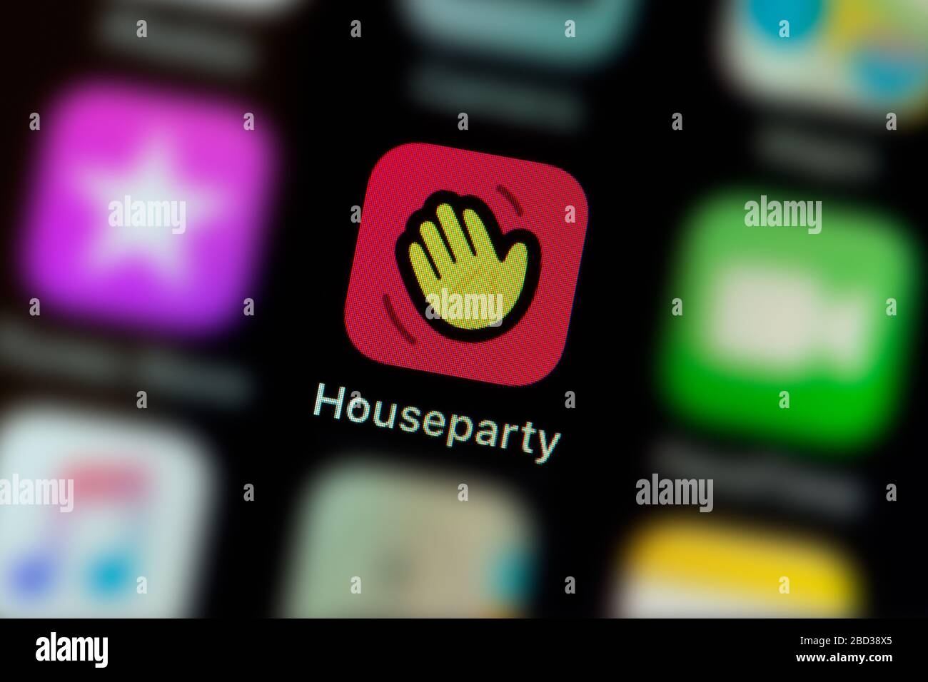 A close-up shot of the Houseparty app icon, as seen on the screen of a smart phone (Editorial use only) Stock Photo