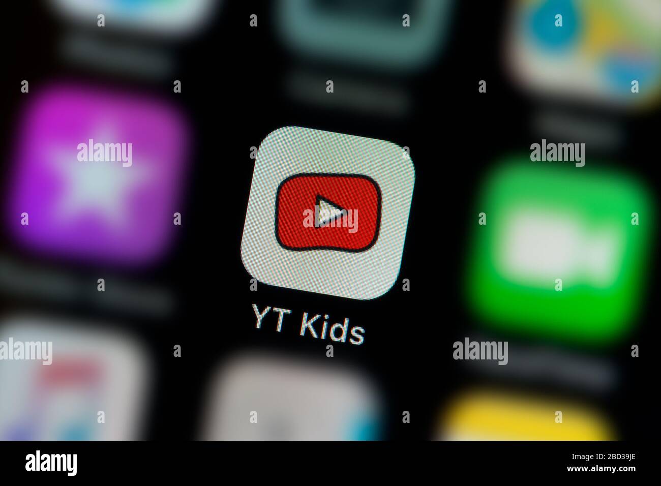 A close-up shot of the Youtube Kids app icon, as seen on the screen of a smart phone (Editorial use only) Stock Photo