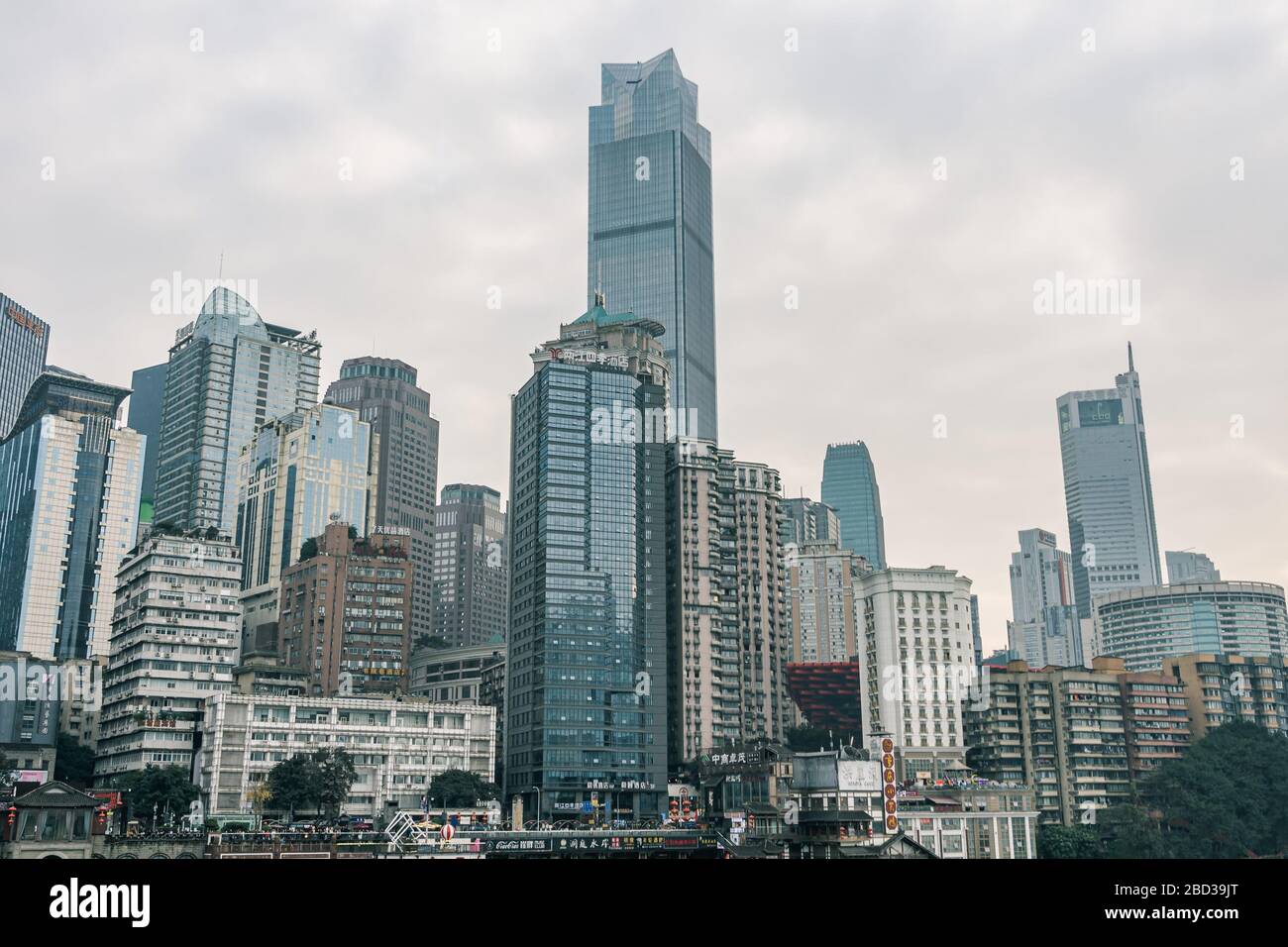 Chongqing, China - Dec 22, 2019: CBD Skyscrapers near Hongya dong cave by Jialing river Stock Photo