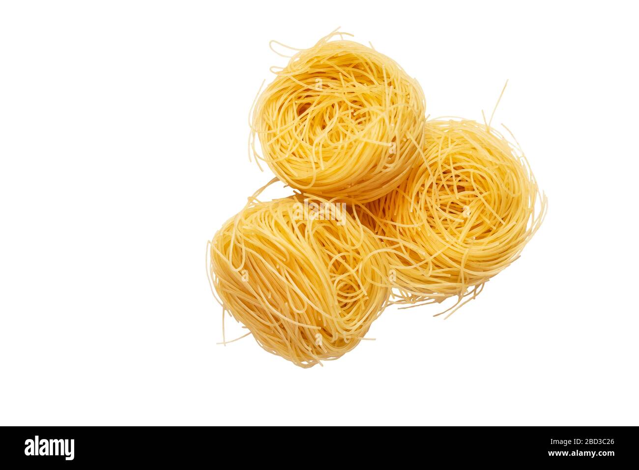 3 pieces of Italian egg pasta tagliatelle nest isolated on white