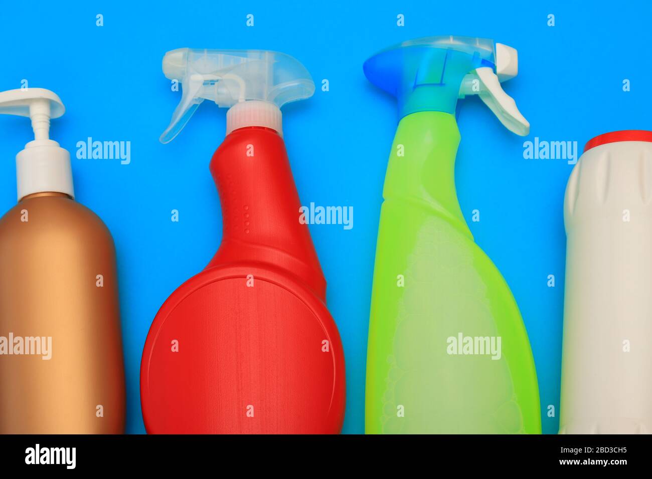 Plastic washing containers on a blue background for the cleaning the kitchen, bathroom