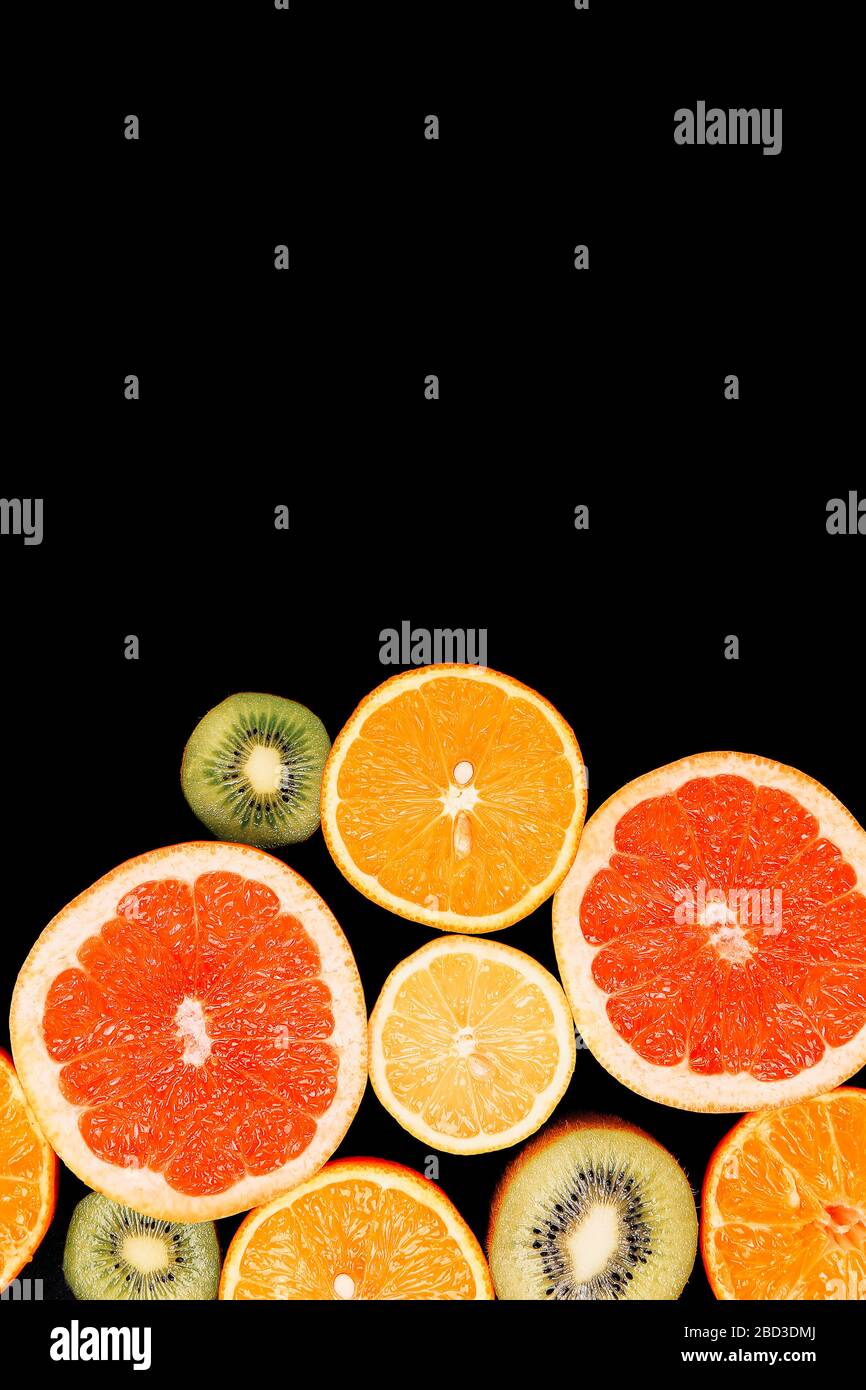 Citrus fruits background orange lemon grapefruit mandarin kiwi. Flatlay