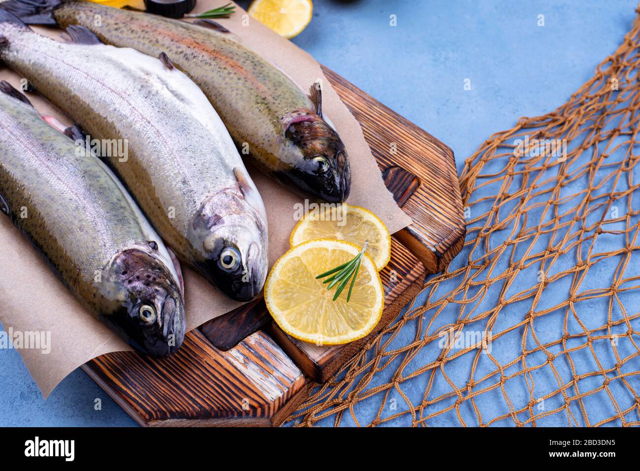 Raw uncooked trout with lemon Stock Photo Alamy