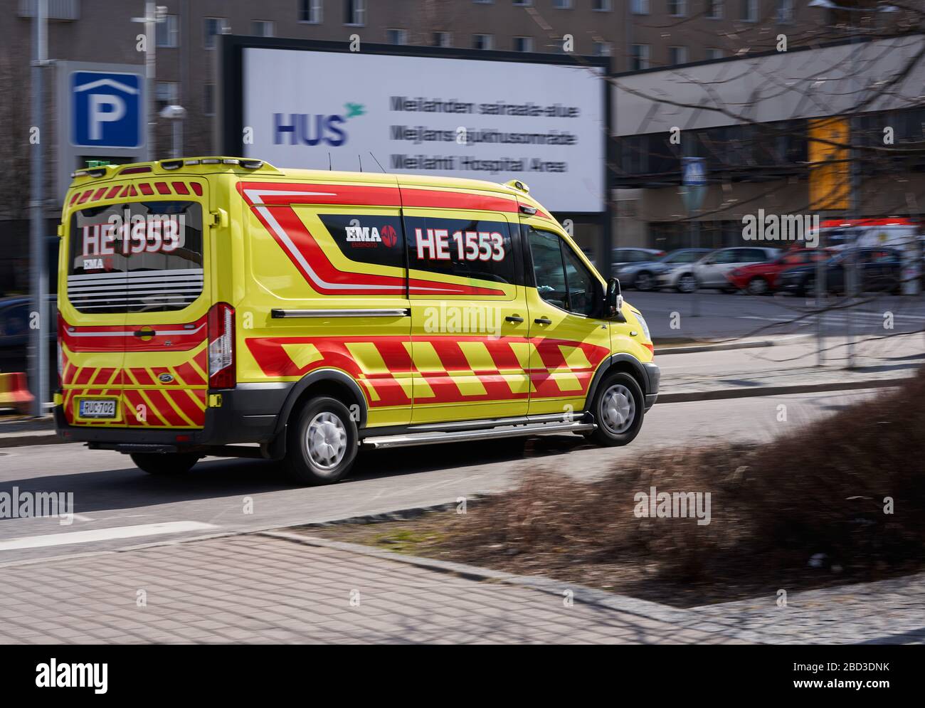 Helsinki, Finland - April 4, 2020: An ambulance arriving in high speed to the Meilahti Hospital area during the covid-19 pandemic outbreak. Stock Photo