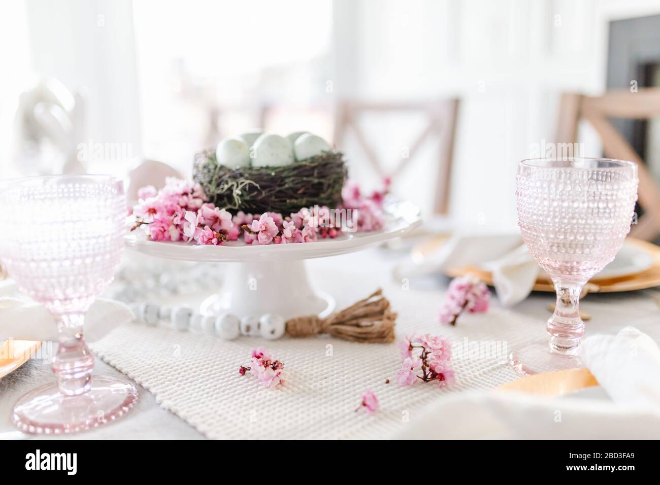 Close up of cherry blossom easter dining tablescape Stock Photo