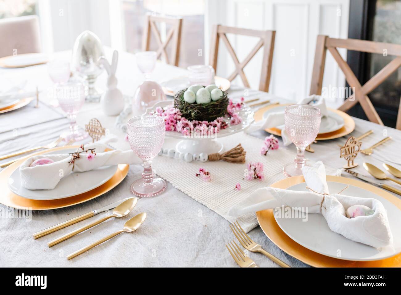 Easter tablescape with pink touches and eggs Stock Photo