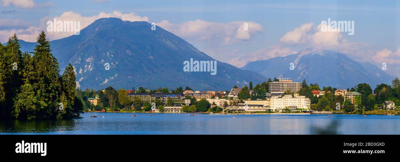 Bled, Slovenia - August 09, 2019: Amazing view on Bled Lake, hotels, parks and beaches situated on the bank, surrounded by forest and mountains Stock Photo