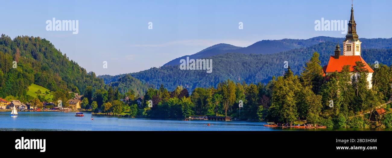 Bled, Slovenia - August 09, 2019: Amazing view on Bled Lake with church dedicated to the Assumption of Mary on a small island, Julian Alps, Slovenia Stock Photo