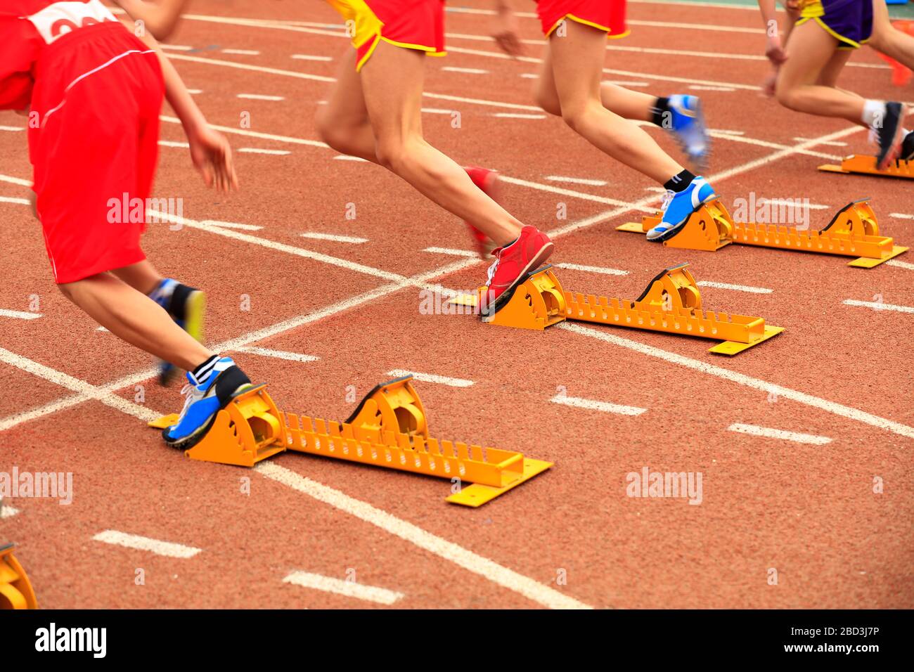 sprint start in track and field in blurred motion Stock Photo Alamy