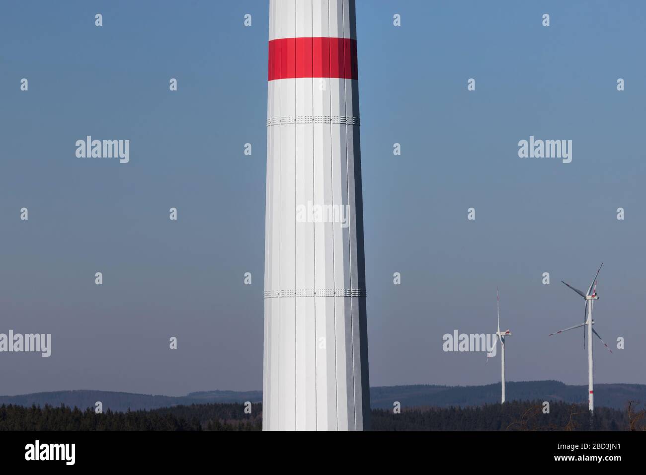 modern wind turbine column in front of the evening sun Stock Photo - Alamy