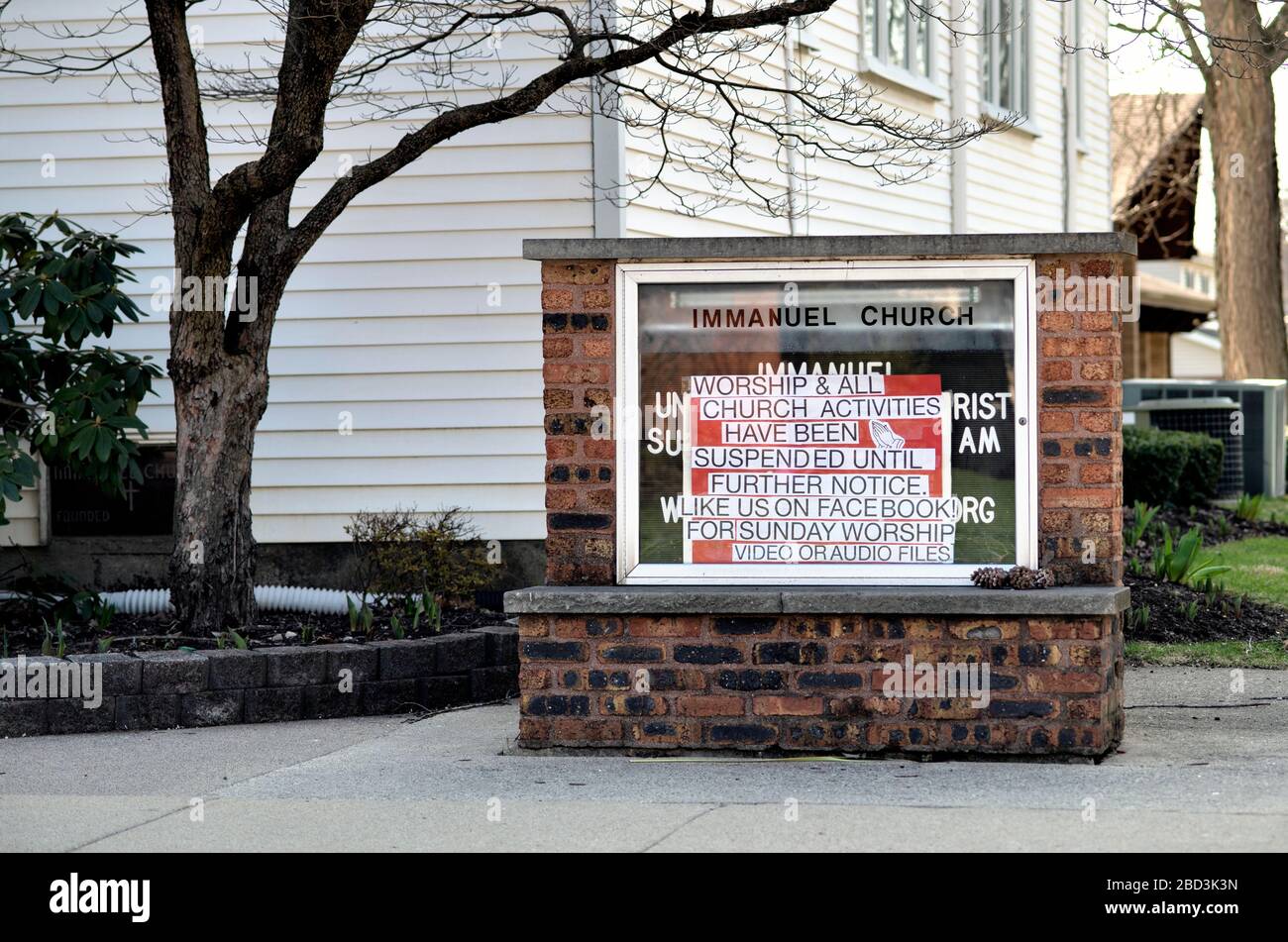 Bartlett, Illinois, USA. A community church posts a sign over its usual hours of worship display as all churches have been closed in the United States. Stock Photo