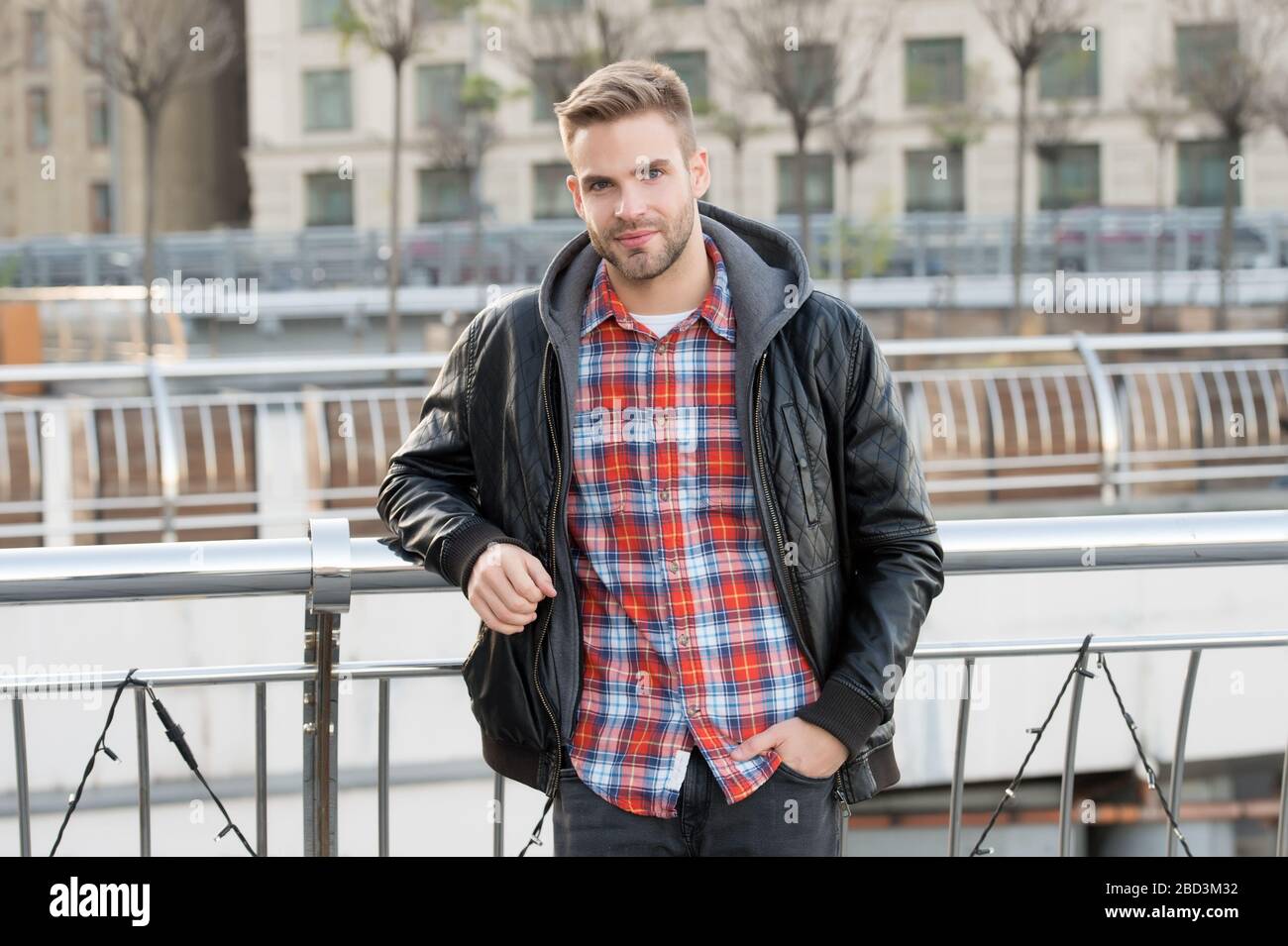 He likes autumn. Caucasian man on autumn day. Handsome guy wear 