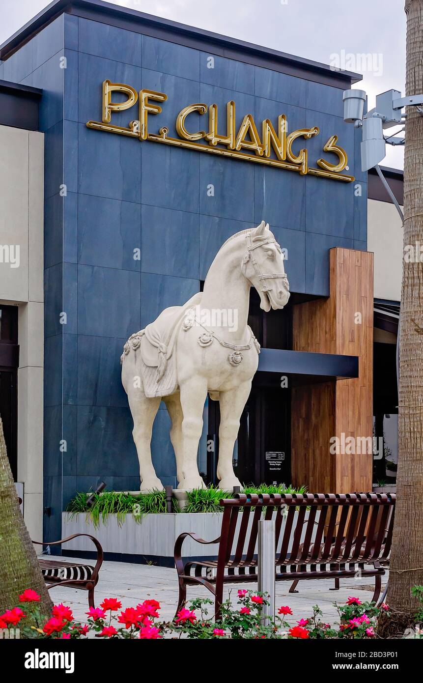 A concrete horse statue stands guard in front of P.F. Chang’s restaurant, March 29, 2020, in Mobile, Alabama. Stock Photo