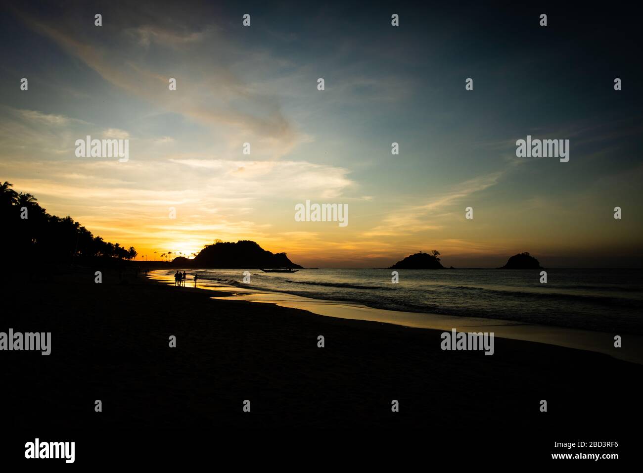 Islands silhouetted at twilight on Nacpan Beach in El Nido, Palawan, Philippines Stock Photo