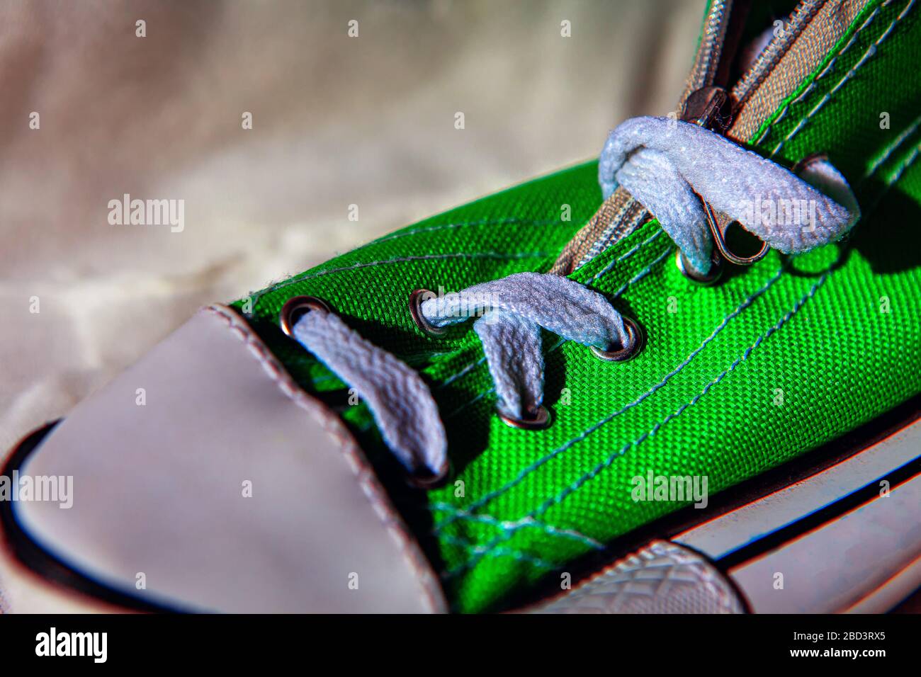 green sneakers with white shoelaces Stock Photo Alamy