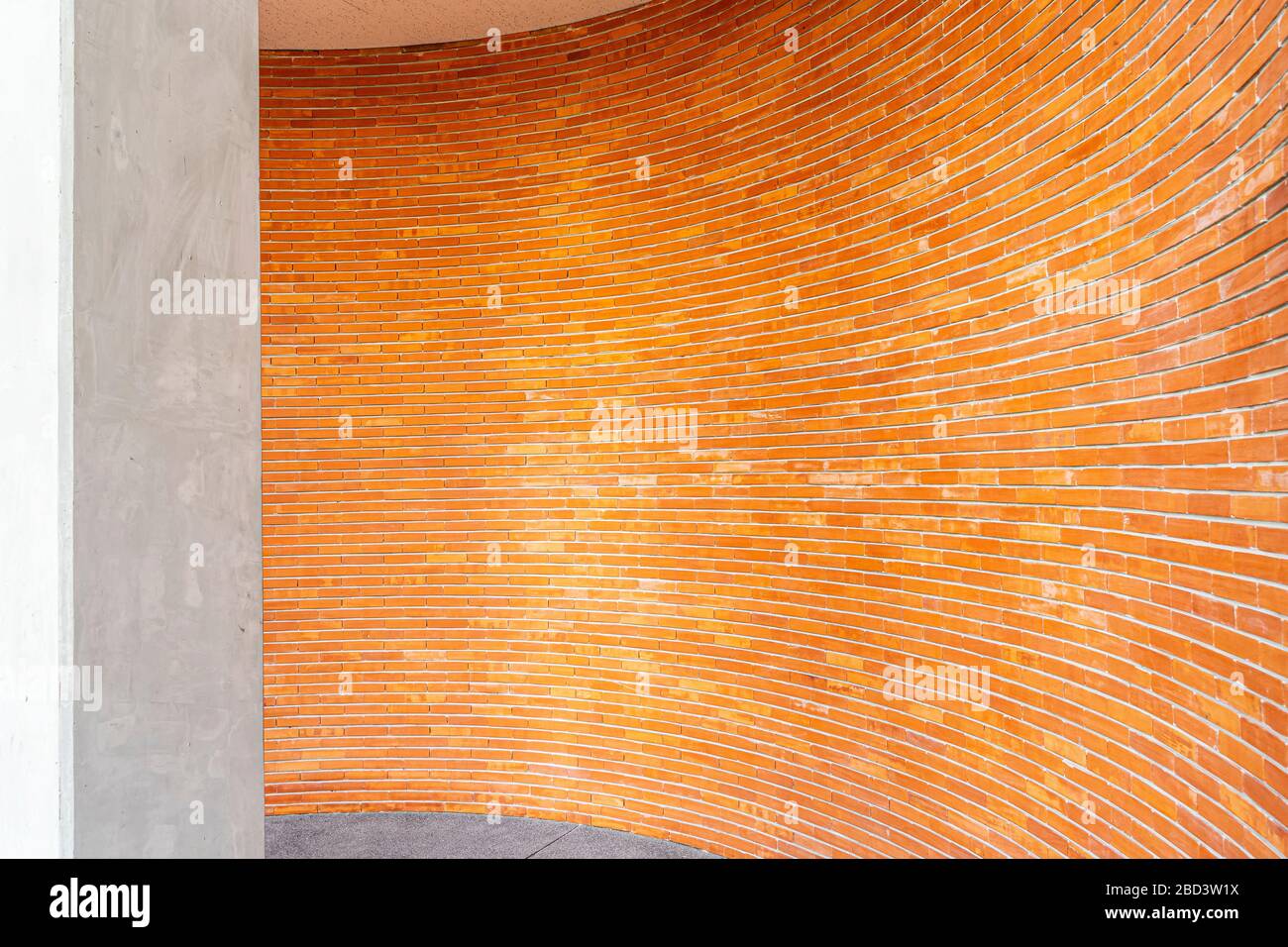 Red brick pattern on wall in curve on building. Abstract background ...