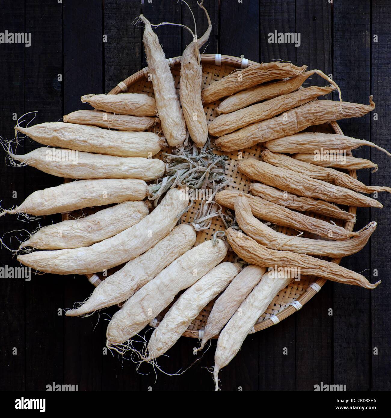 Top view bamboo tray of salted radish that dried, home made raw