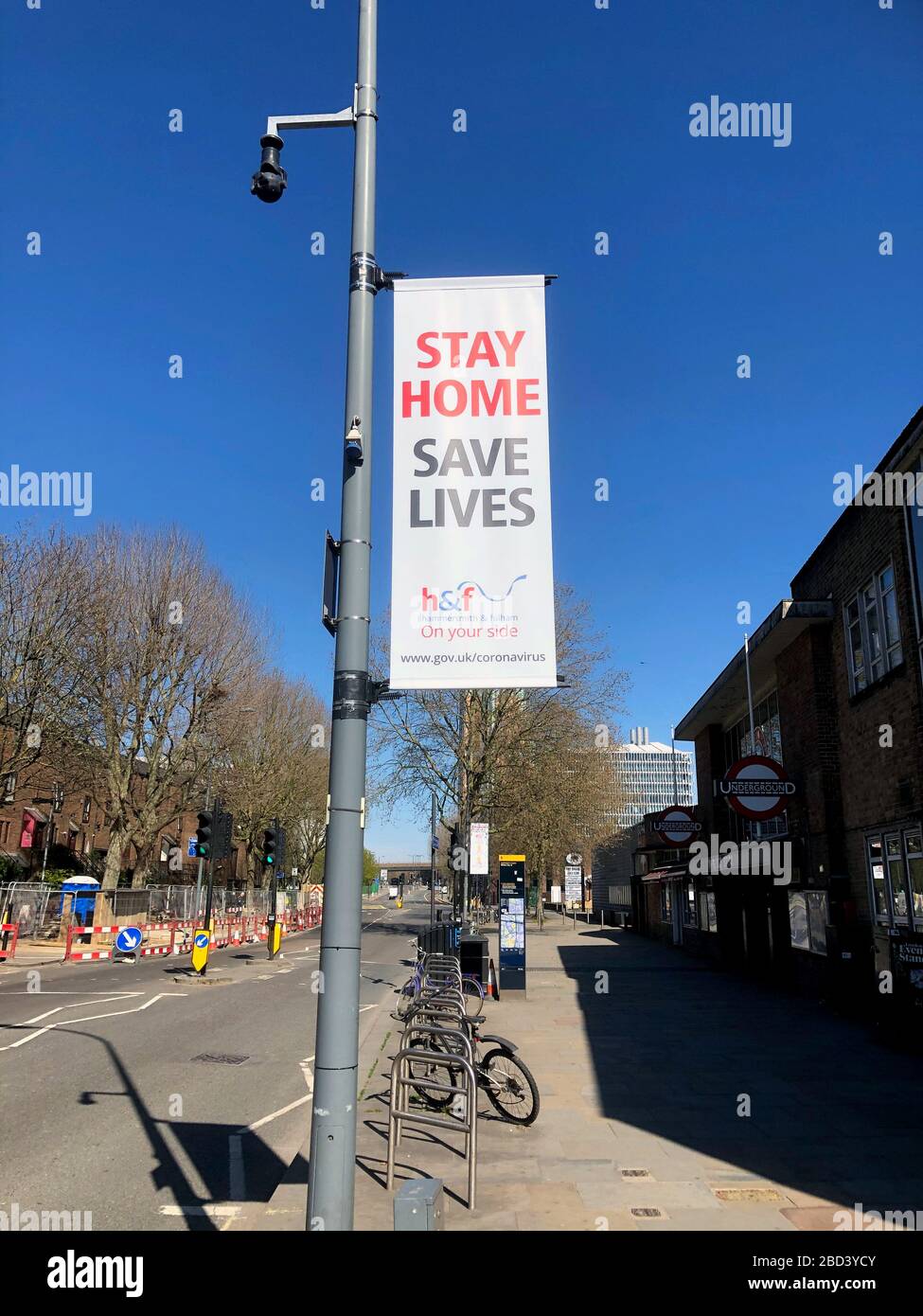 London, UK. 06th Apr, 2020. A placard that says stay home, save life hangs on a street poll around White City station to encourage locals to follows the shutdown rules.Boris Johnson, announced strict lockdown measures urging people to stay at home and only leave the house for basic food shopping, exercise once a day and essential travel to and from work. Around 50,000 reported cases of the coronavirus (COVID-19) in the United Kingdom and 5,000 deaths. The country is in its third week of lockdown measures aimed at slowing the spread of the virus. Credit: SOPA Images Limited/Alamy Live News Stock Photo