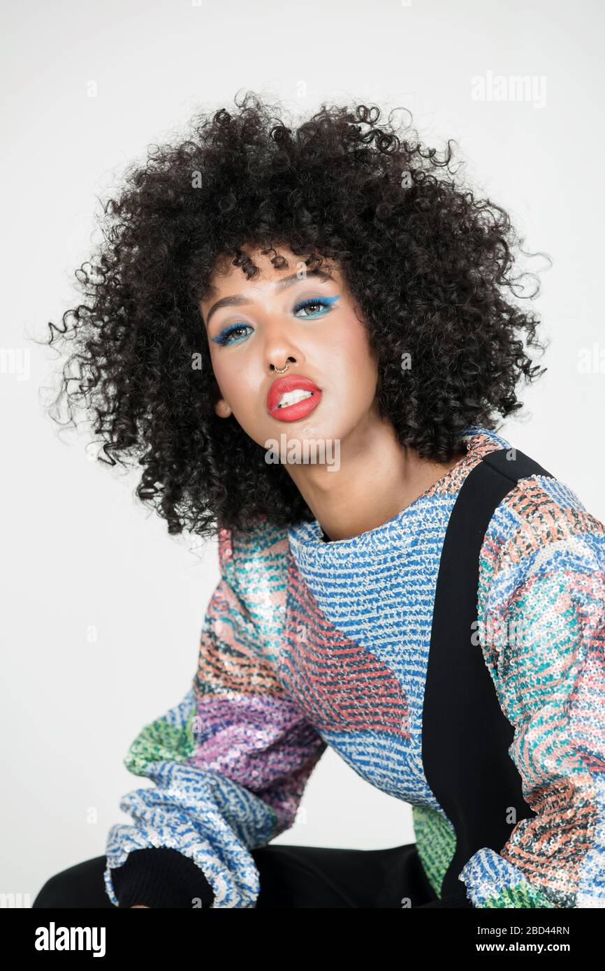 Dee Mohamud is a Dubai based fashion and beauty Content Creator and YouTuber. Known for her signature curly afro and colorful style. Stock Photo