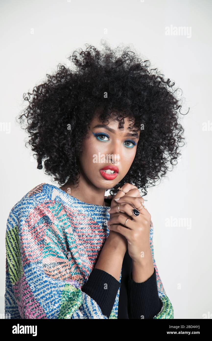 Dee Mohamud is a Dubai based fashion and beauty Content Creator and YouTuber. Known for her signature curly afro and colorful style. Stock Photo