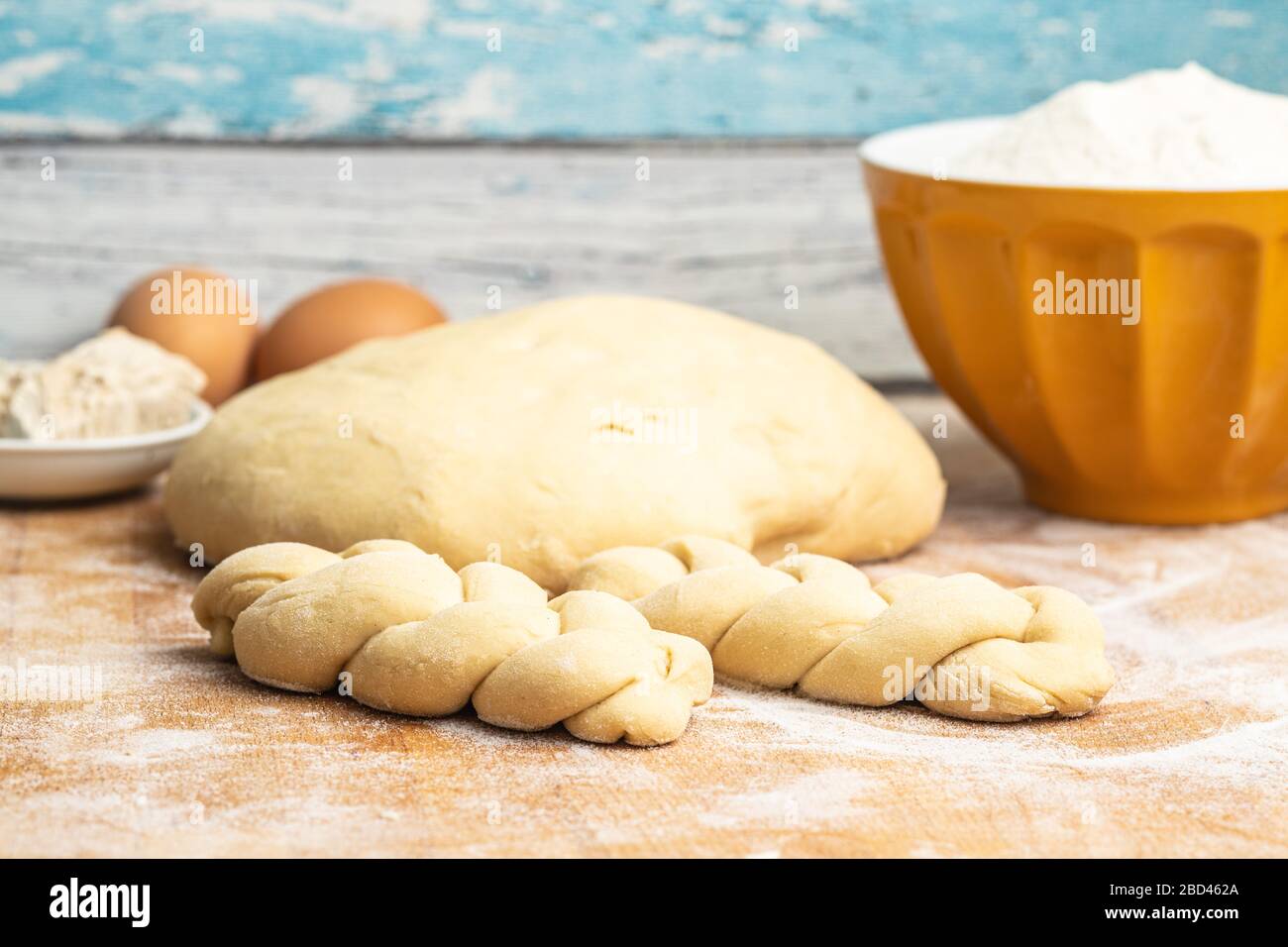 Unbaked braided bun dough. Raw dough. Unbaked buns. Stock Photo