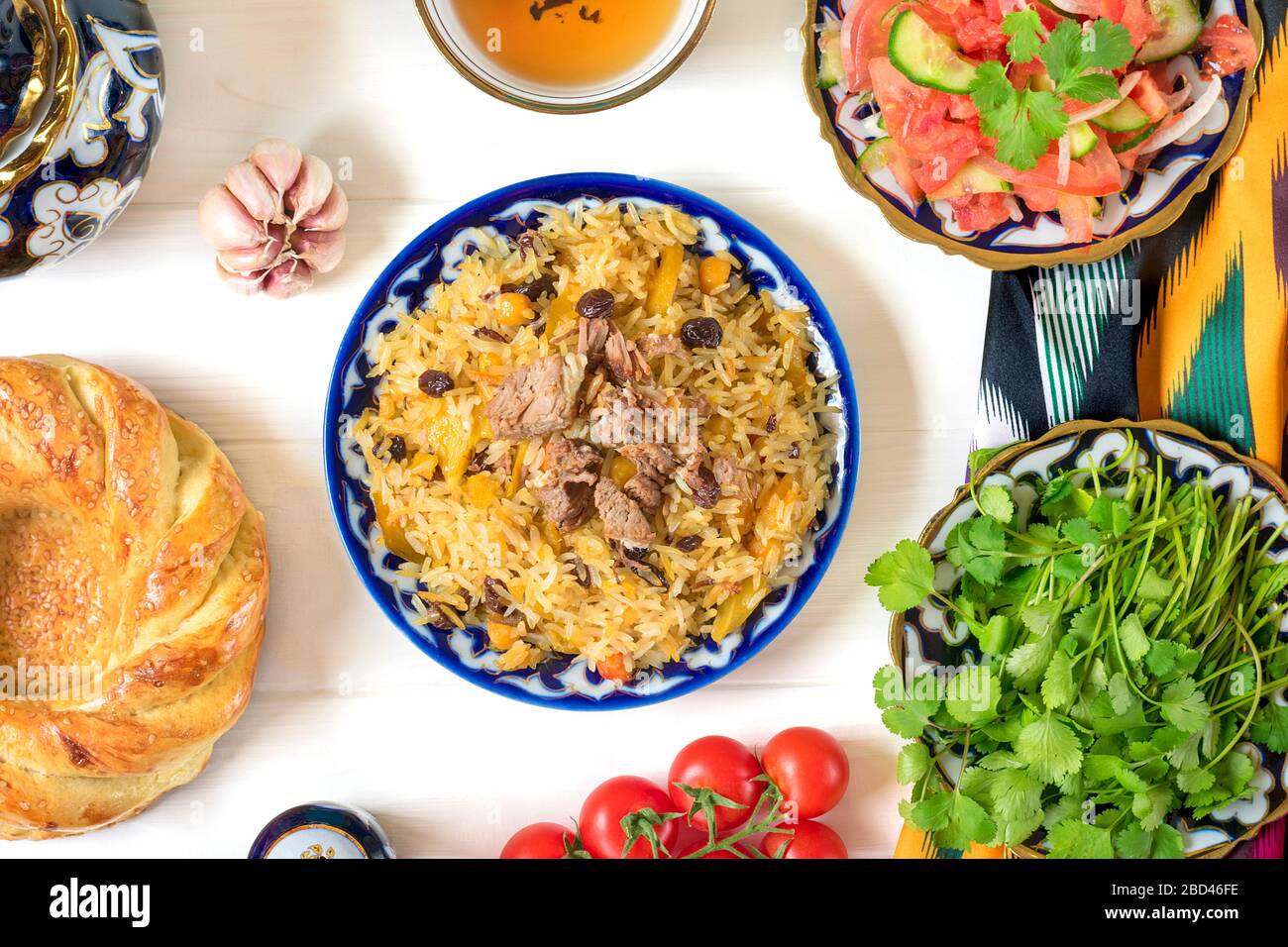Pilaf Pattern National Uzbek pilaf with meat, achichuk salad of tomato, cucumber ...