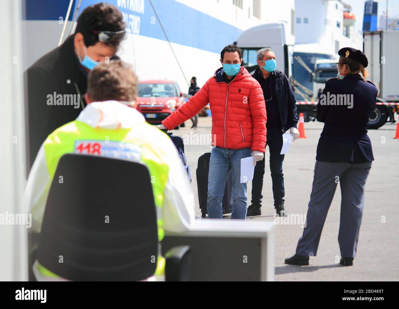 talian citizens disembarked at the port are subjected to health checks by the health authorities cause covid-19. Stock Photo