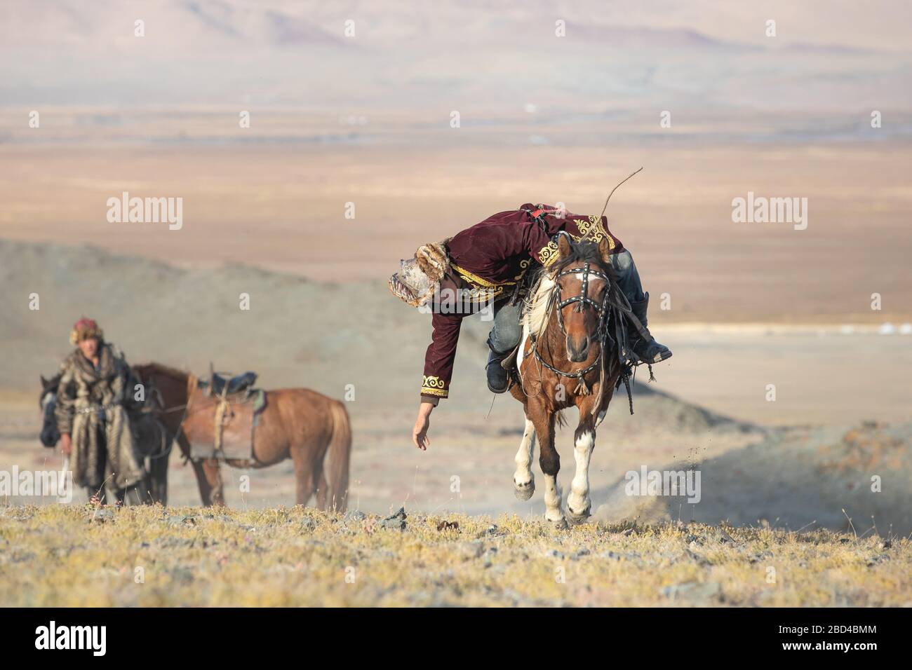Traditional Mongolian game where a rider on horseback aims to pick up a