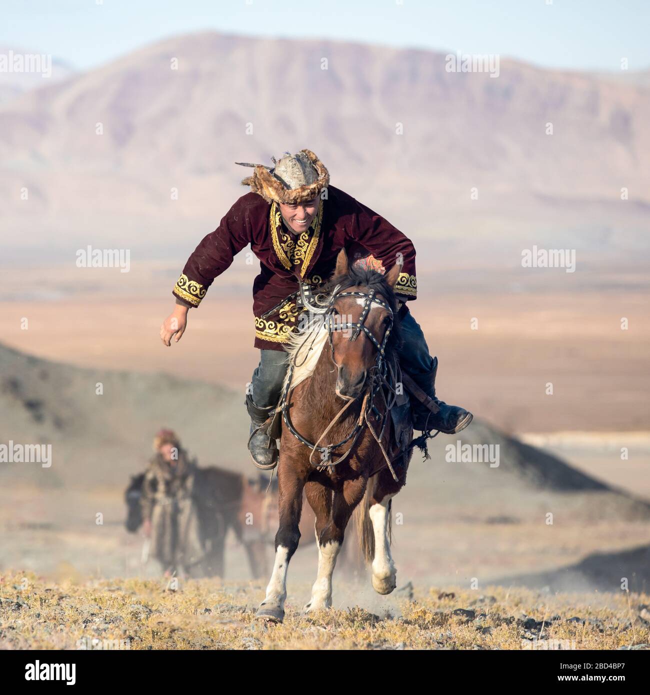 Traditional Mongolian game where a rider on horseback aims to pick up a