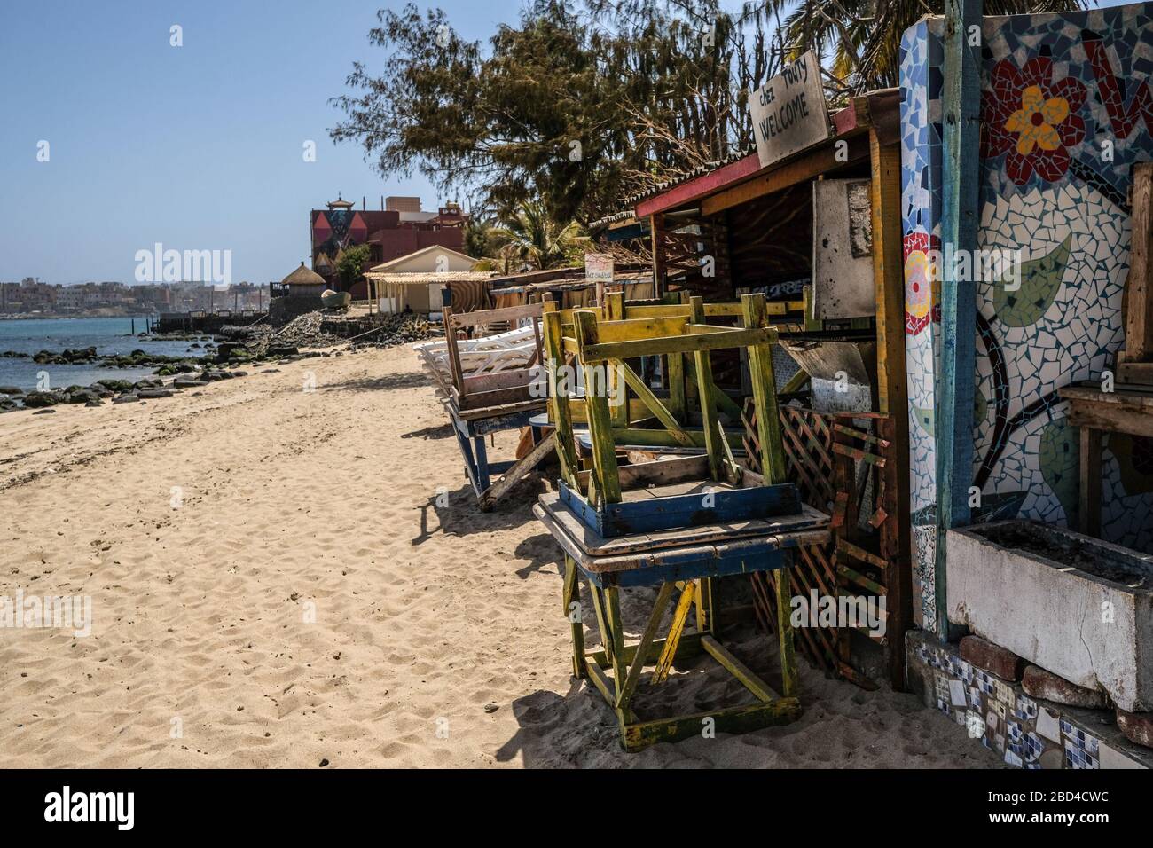 Dakar. 6th Apr, 2020. Photo taken on April 6, 2020, shows piled-up chairs and tables outside closed restaurants on Ngor Island, Dakar, Senegal. On Saturday night, Senegalese President Macky Sall extended in a presidential decree the current state of emergency, along with the dusk-to-dawn curfew for 30 days, till May 4. The country's total number of confirmed cases reached 226, among which 92 patients have been cured. Credit: Eddy Peters/Xinhua/Alamy Live News Stock Photo