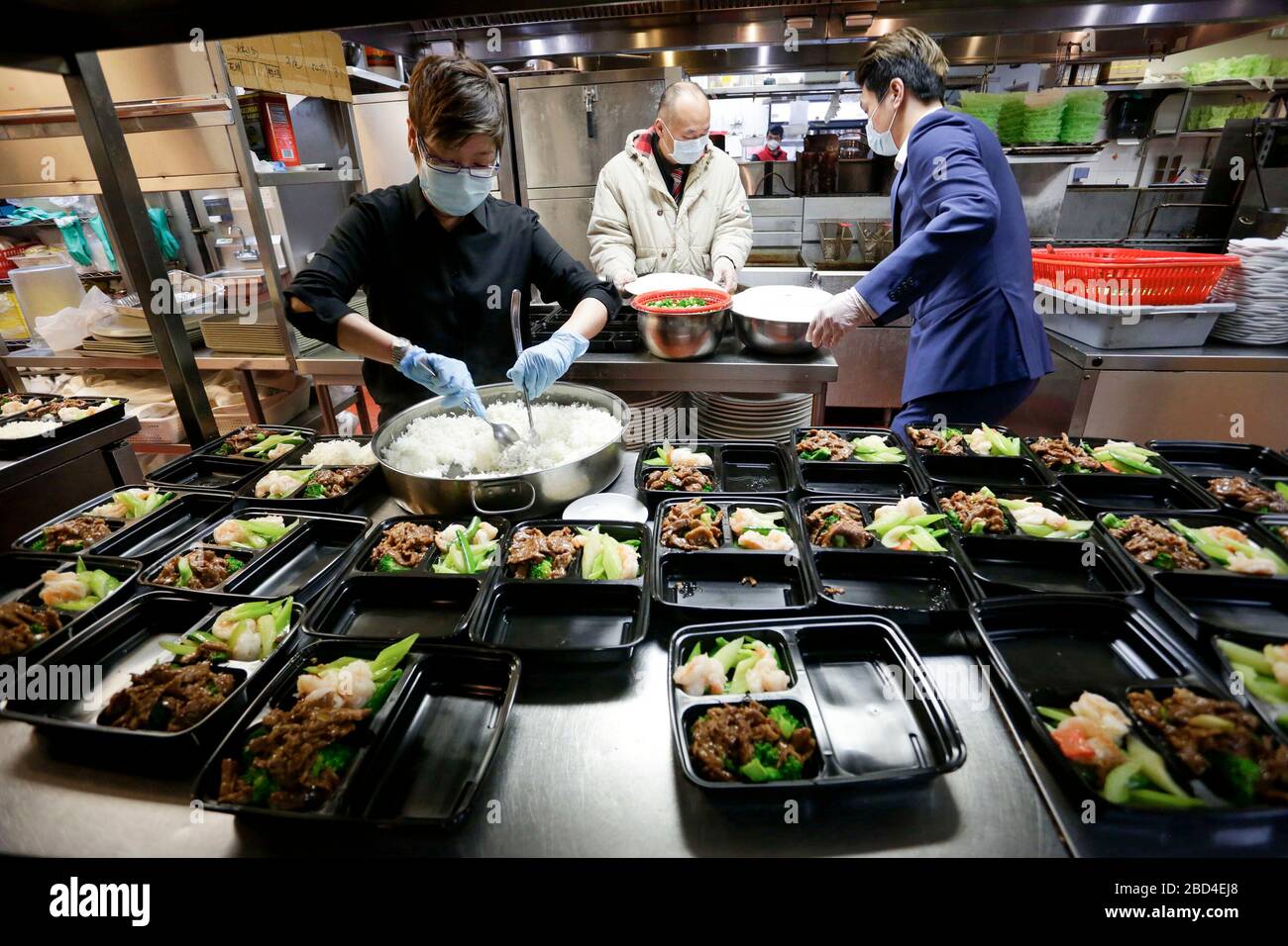 Vancouver, Canada. 6th Apr, 2020. Staff members of a Chinese restaurant prepare meal boxes inside the kitchen for the frontline workers of Vancouver General Hospital in Vancouver, Canada, April 6, 2020. The Canadian government is recruiting volunteers to support frontline healthcare workers to combat the COVID-19 crisis. Some local Chinese restaurants donated meals to the frontline healthcare workers fighting COVID-19. Credit: Liang Sen/Xinhua/Alamy Live News Stock Photo