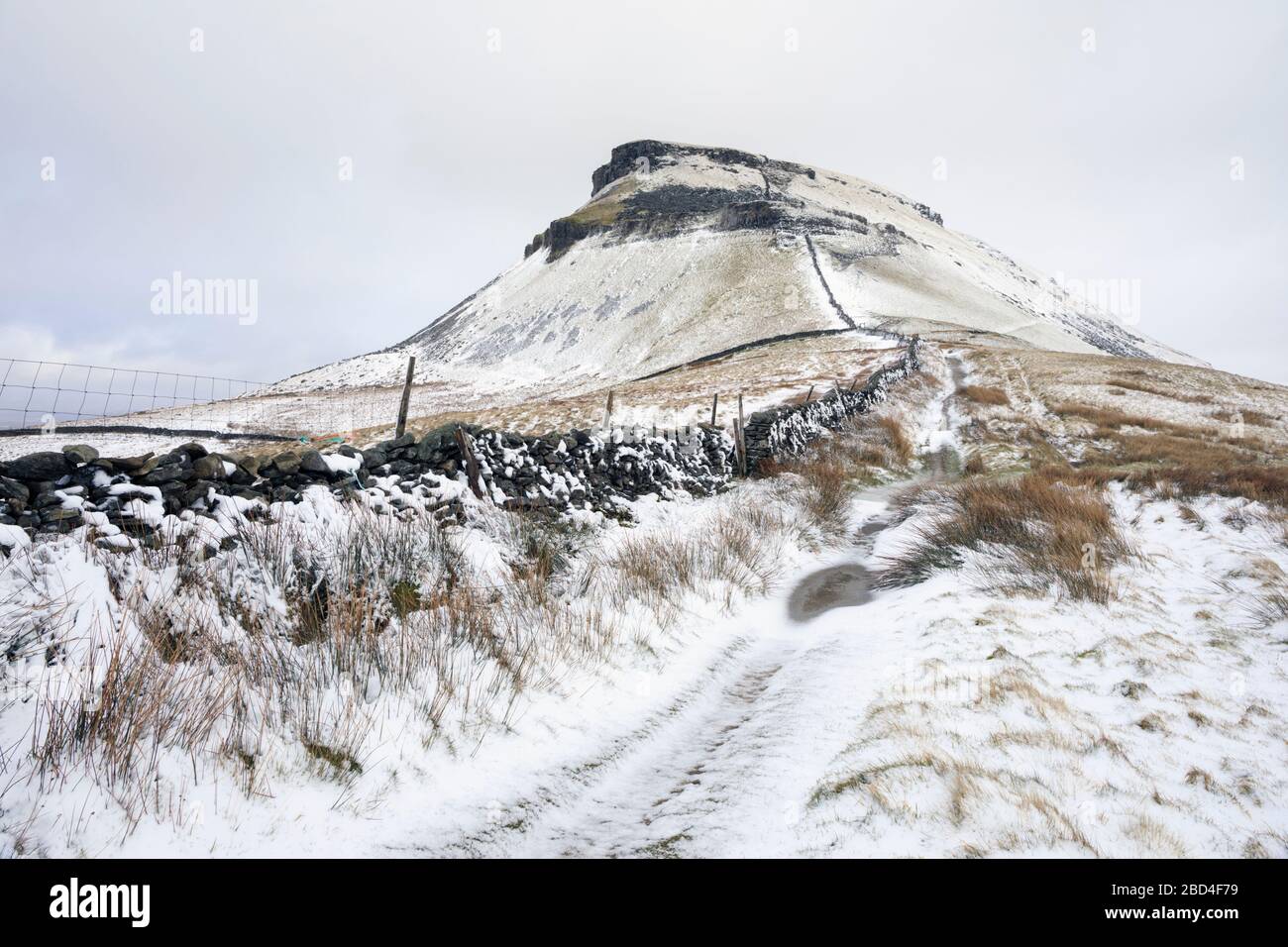 Pen-y-ghent in the Yorkshire Dales National Park captured after a snowfall. Stock Photo