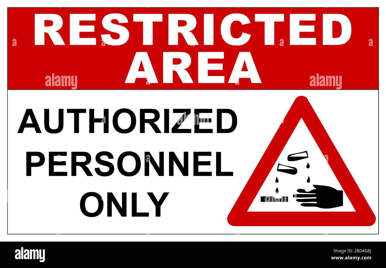 Restricted area sign with corrosive substances warning Stock Photo