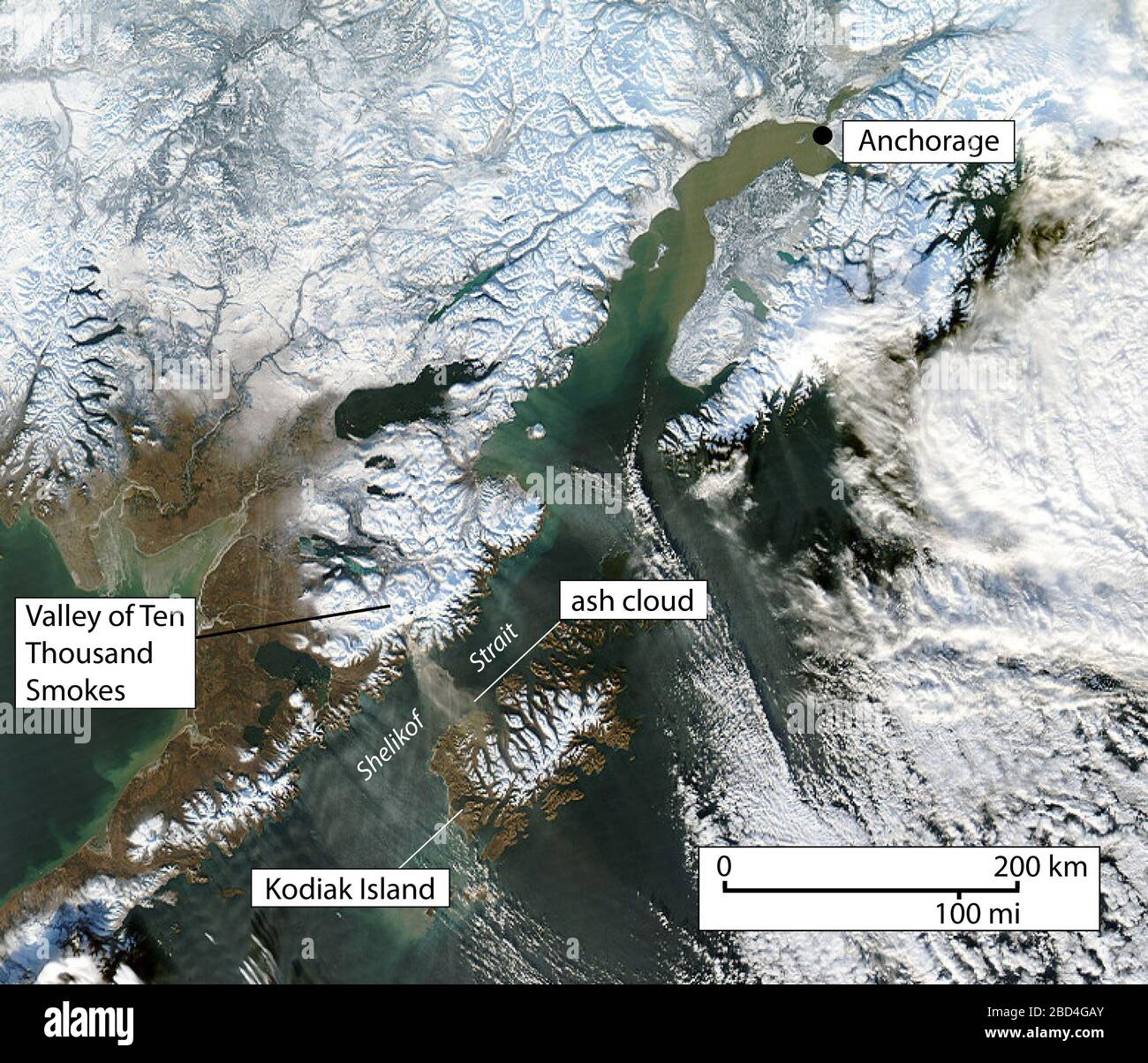 MODIS Aqua 1 km true color satellite image showing resuspended volcanic ash cloud (arrow) generated from high winds scouring exposed ash on the Pacific side of the Katmai volcanic range. The cloud stretches across the Shelikof Straight and western Kodiak Island. Image ID 2010333 taken November 29, 2010 Stock Photo