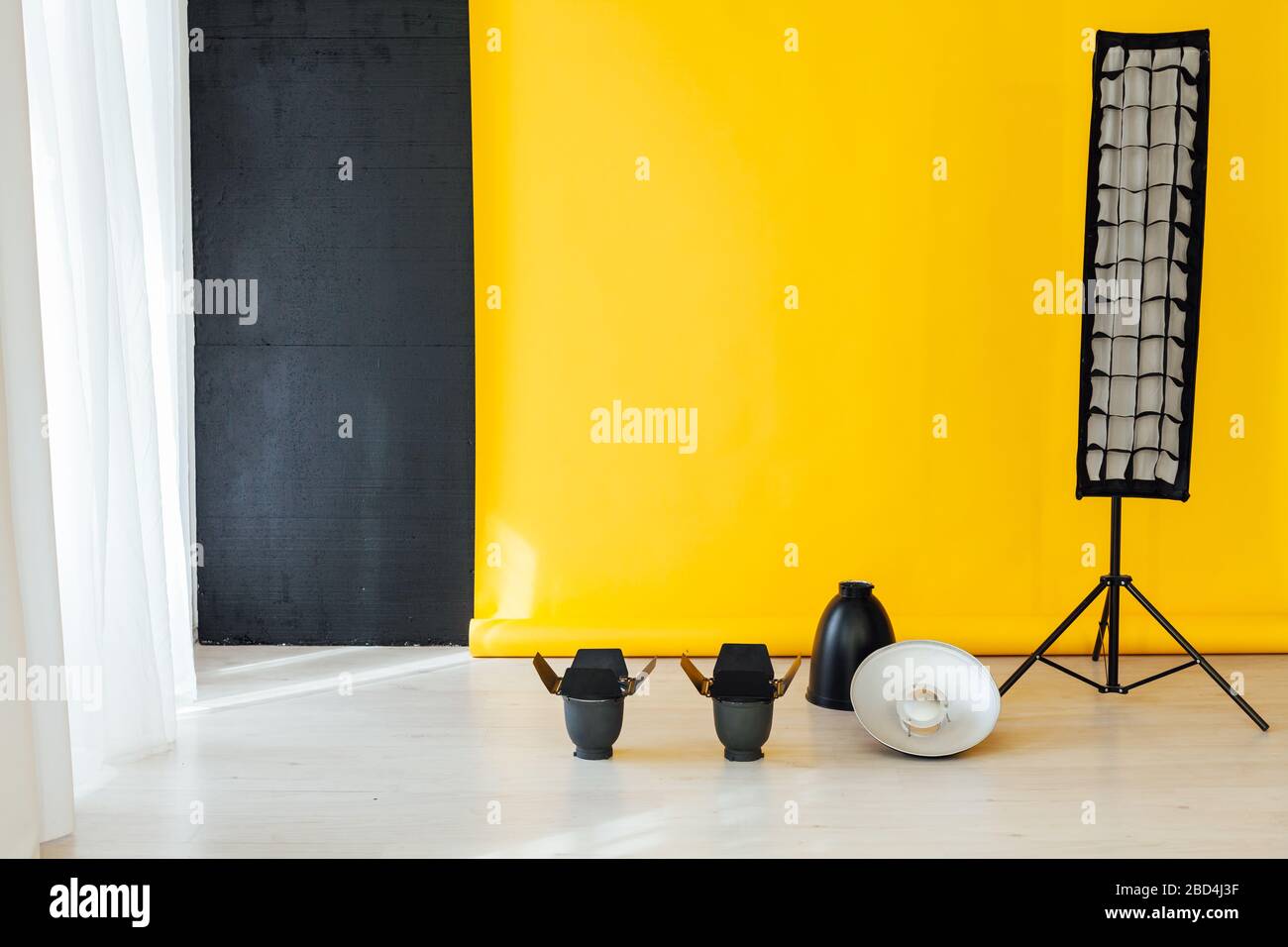 flash and accessories photo studio on a yellow background Stock Photo Alamy