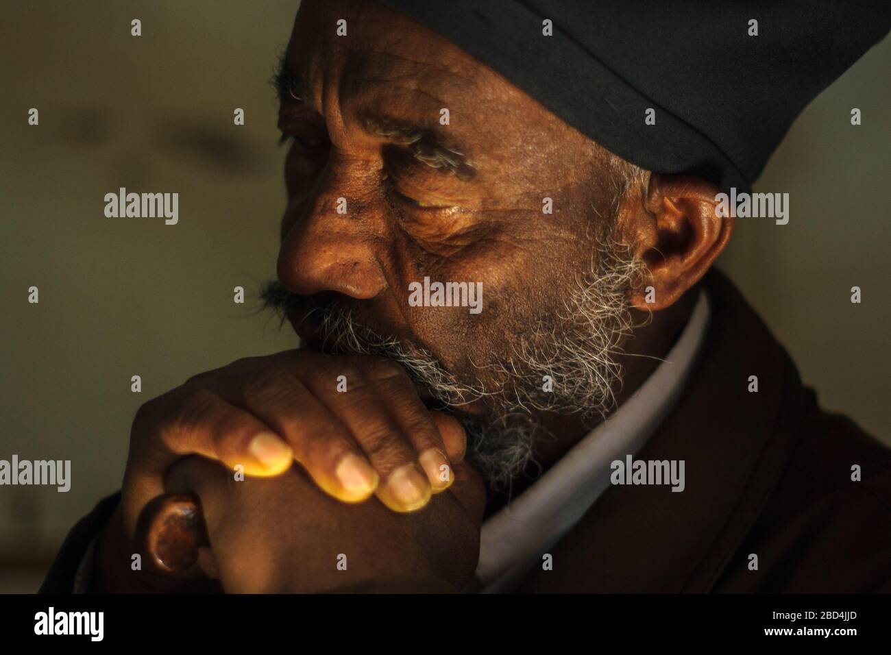 Jerusalem, Israel - April 23, 2010: Portrait of a monk of the Ethiopian Orthodox Tewahedo Church, in the Church of the Holy Sepulchre, Old City, Jerus Stock Photo