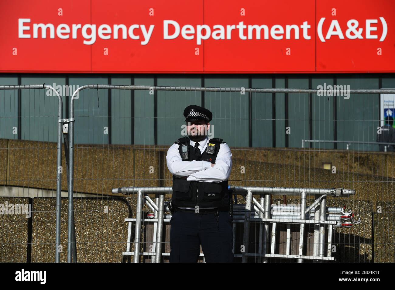 Police officer on patrol outside St Thomas' Hospital in Central London where Prime Minister Boris Johnson is in intensive care as his coronavirus symptoms persist. Stock Photo