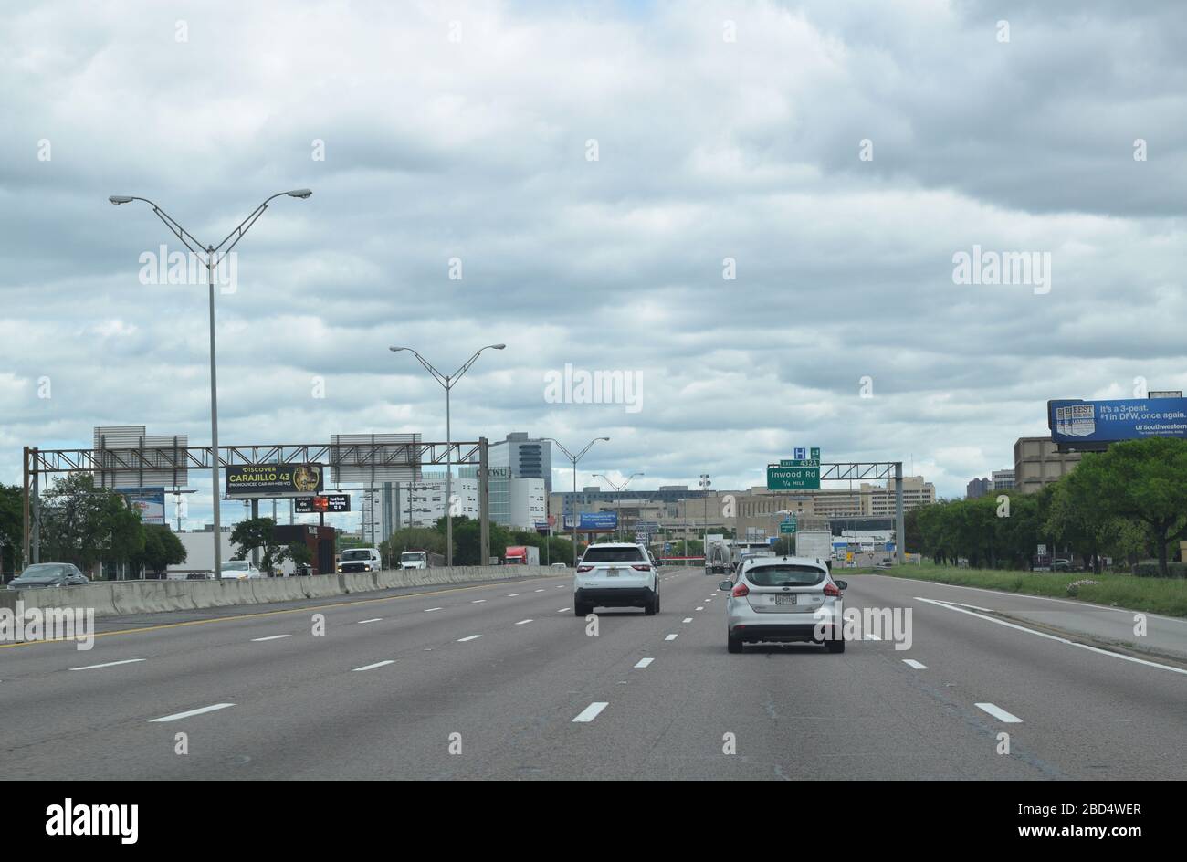 Interstate 35E traveling toward downtown Dallas has moderate traffic in the middle of a weekday despite the 'stay at home' order imposed by Dallas County and the city of Dallas. Stock Photo