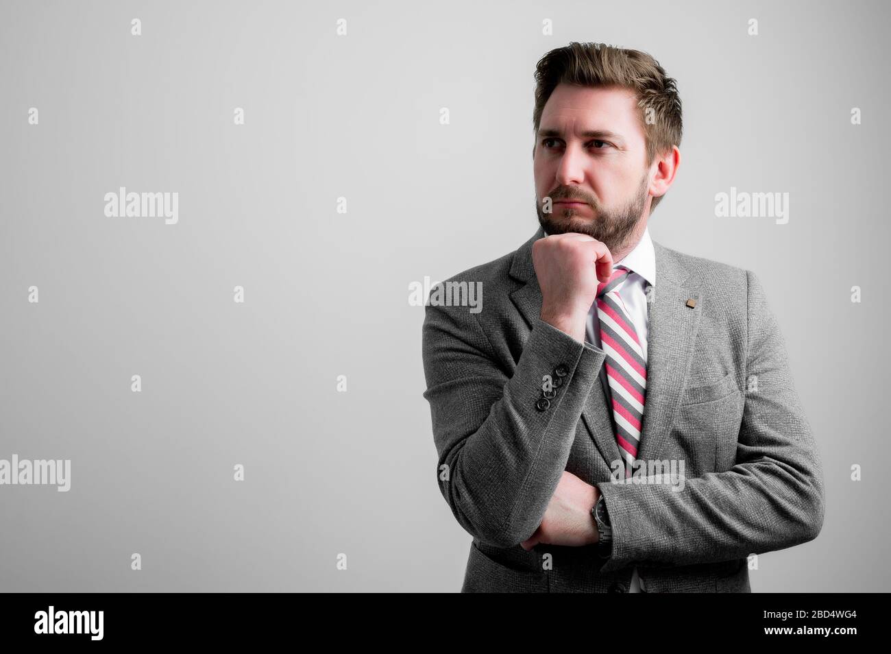 Portrait of business man wearing business clothes making thinking