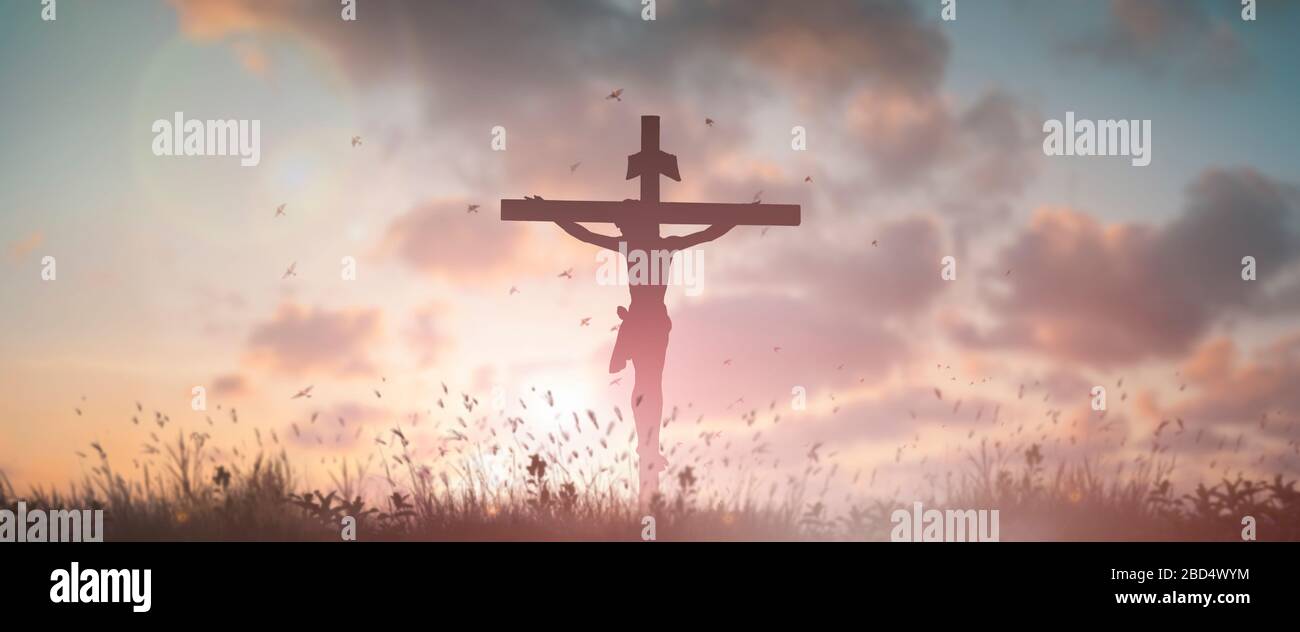 Silhouette Jesus christ death on cross crucifixion on calvary hill in sunset good friday risen in easter day concept for Christian praise for holy spi Stock Photo