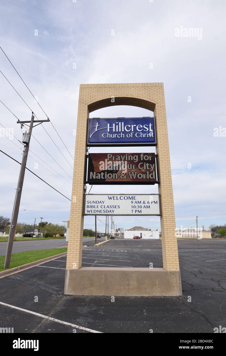 Churches in Abilene, TX are closed in response to a call for social distancing by Texas Governor Abbott, President Trump and the CDC. Hillcrest Church of Christ announces on their electronic sign a call for prayer and an annoucement for their online services. Stock Photo