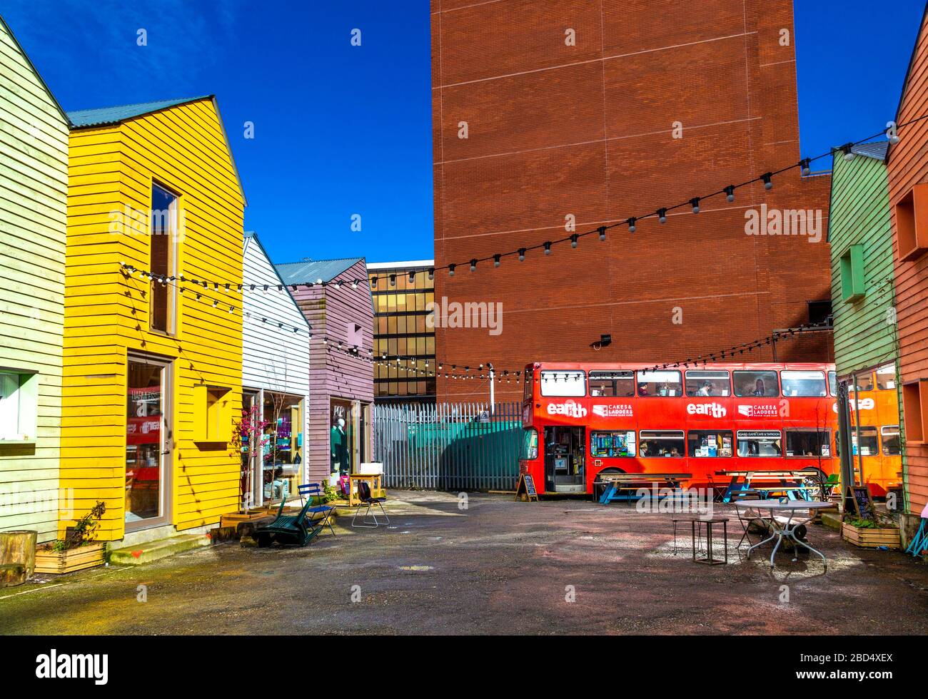 Blue House Yard and Cakes & Ladders boardgames double decker cafe bus in Wood Green, London, UK Stock Photo