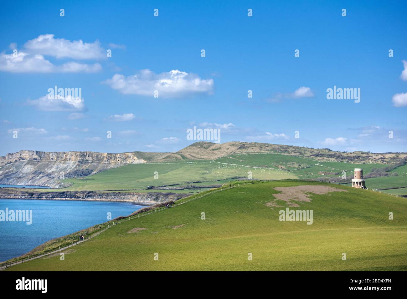 View down the Jurassic coastline in Dorset towards Kimmeridge Bay, showing Clavell Tower and Hobarrow Bay in the distance Stock Photo