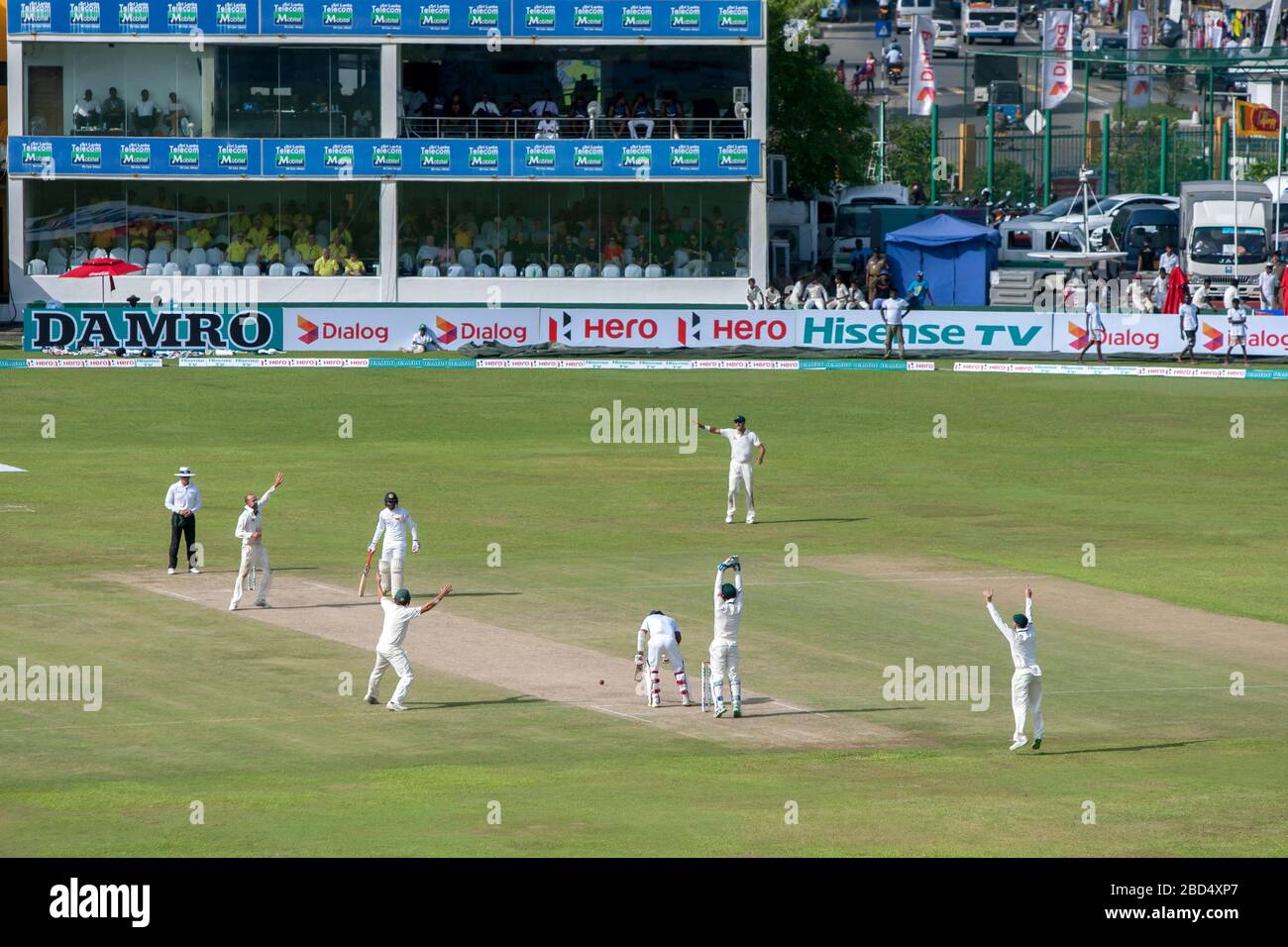 A Test match between Sri Lanka and Australia being played at Galle International Cricket Ground at Galle in Sri Lanka. Australia is appealing for LBW. Stock Photo