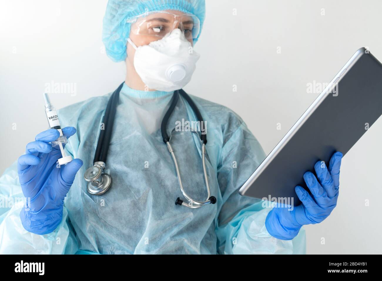 Syringe with the inscription 'Vaccine'. Coronavirus vaccination Stock Photo