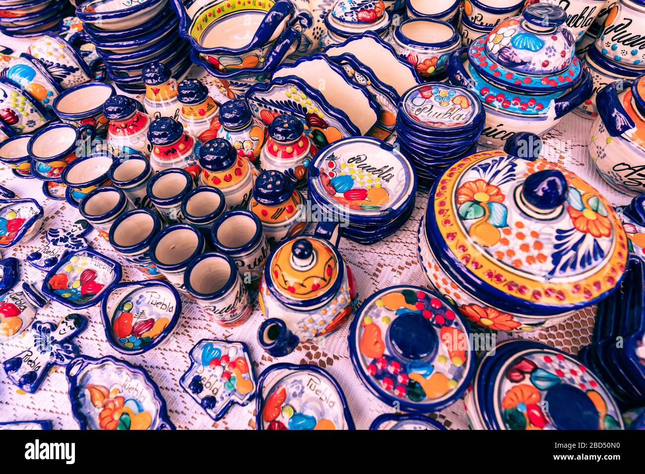 Colorful traditional Mexican pottery. Talavera style. Souvenirs on sale