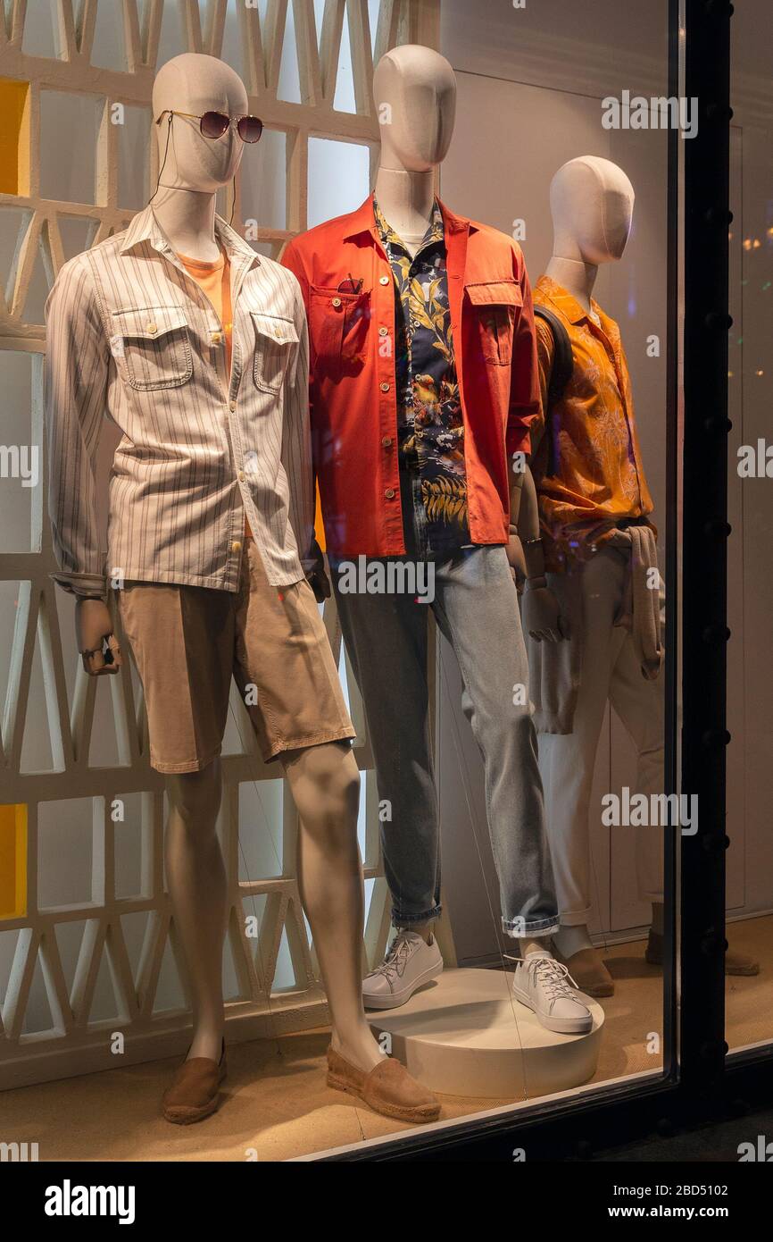 Male mannequins in elegant clothes in a shop window. Fashion Stock ...