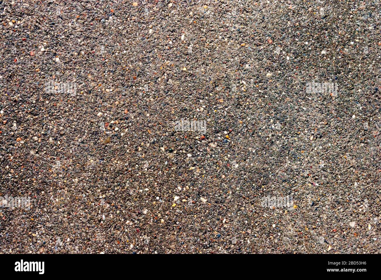 Abstract brown grey asphalt pavement road background. Roadway highway texture pattern backdrop. Stock Photo