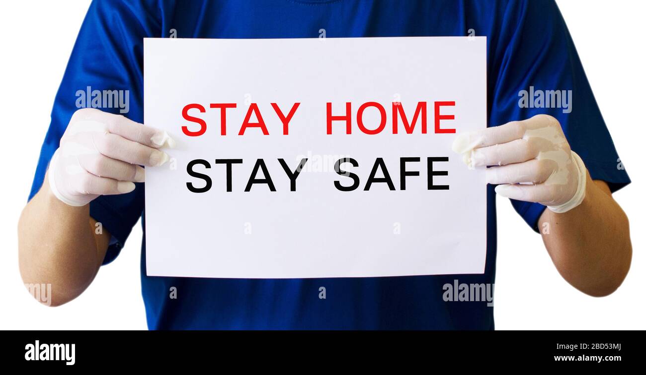 Asian Men Wear Medical Masks N95. Holding a Campaign Banner to Stay Home Stay Safe To Prevent the Outbreak of the Corona Virus That is Spreading Aroun Stock Photo