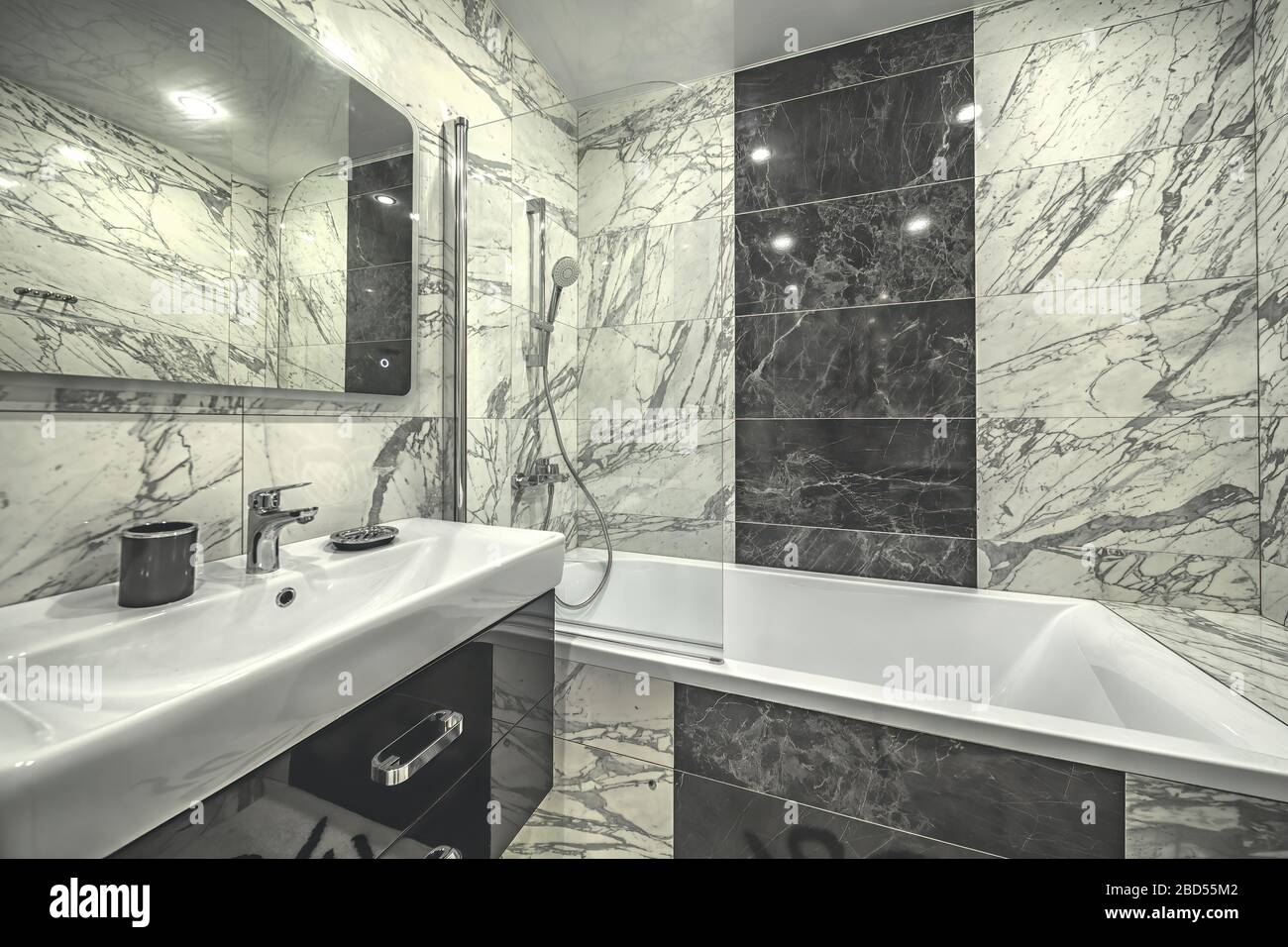 New expensive marble tile bathroom monochrome design in tiny  rental condo apartment Stock Photo